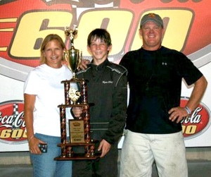 Ryan Shattuck (center) placed first in the 2010 Summer Shootout at Lowes Motor Speedway, mom Cindy and father George Shattuck beaming over his accomplishment.